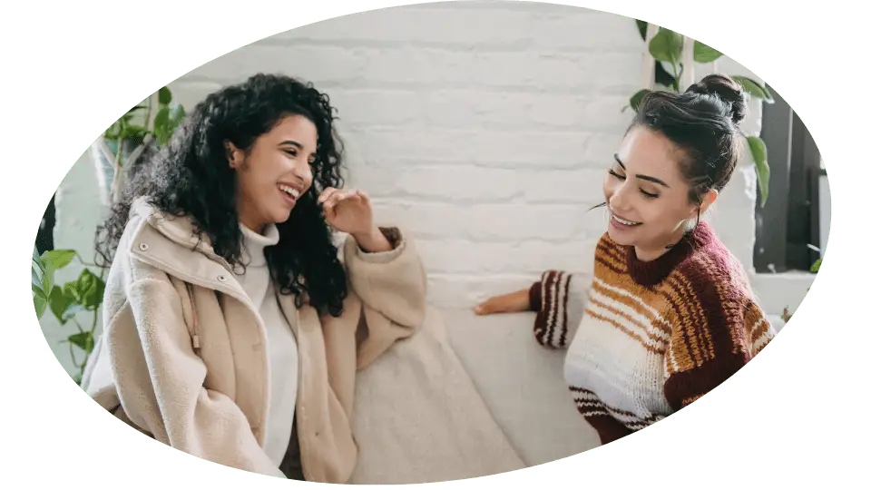 2 women talking. Giving Kensington Nanny a great nanny agency review.