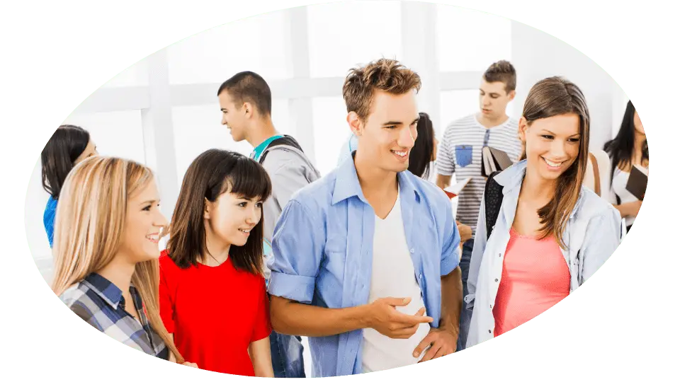 Group of people standing and talking. One is giving Kensington Nanny a great nanny agency review.