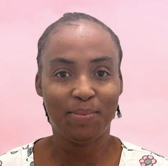 Review of Kensington Nanny jobs by a Baby Nurse, Lena Johnson. Image shows a headshot of Lena wearing her typical scrubs with a soft pink background.