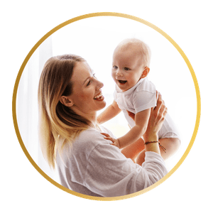 Palm Beach nanny is holding a happy baby